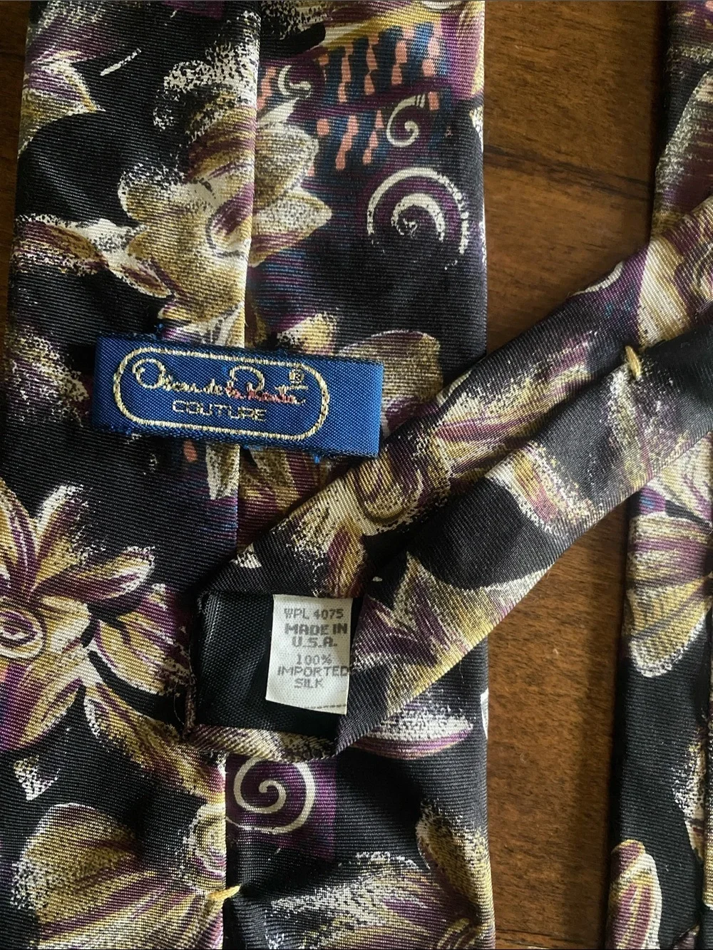 Oscar de la Renta 100% silk Black Tie with Gold and Purple Floral Motif